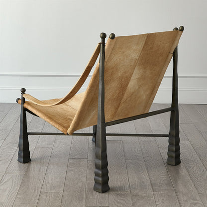 Cognac Ottoman by Global Views. Made from metal, cowhide in a rustic style.