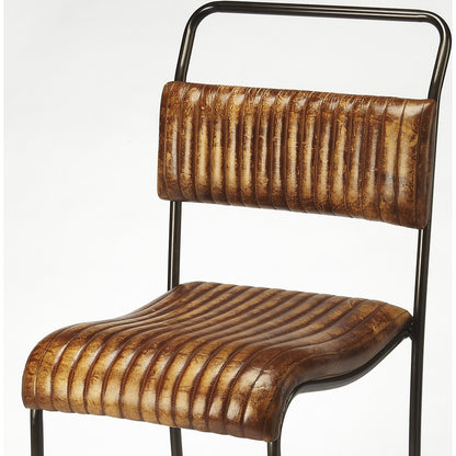 Vega Bar Stool by Butler Specialty Company in light brown and brown leather. Made from iron, leather in a cottage & farmhouse style.