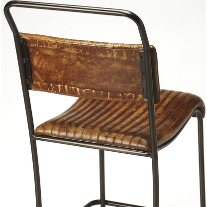Vega Bar Stool by Butler Specialty Company in light brown and brown leather. Made from iron, leather in a cottage & farmhouse style.