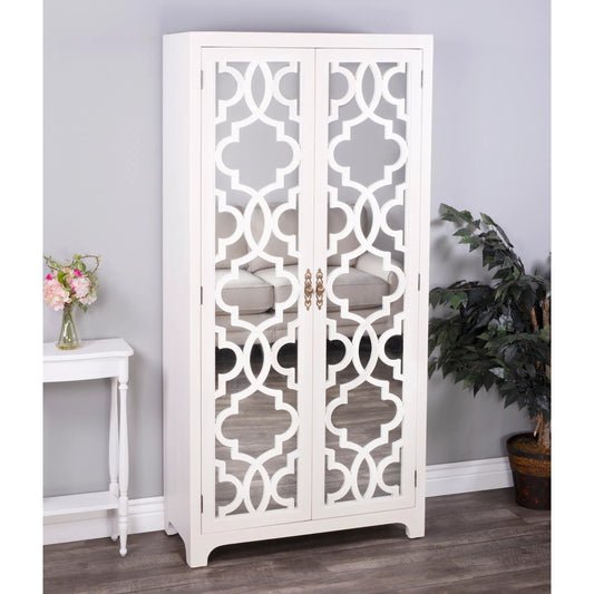 Morjanna White Tall Cabinet by Butler Specialty Company in white and white. Made from mindi wood solids, veneers, mdf, mirrored glass, hardware: steel, antique brass finish in a transitional style.