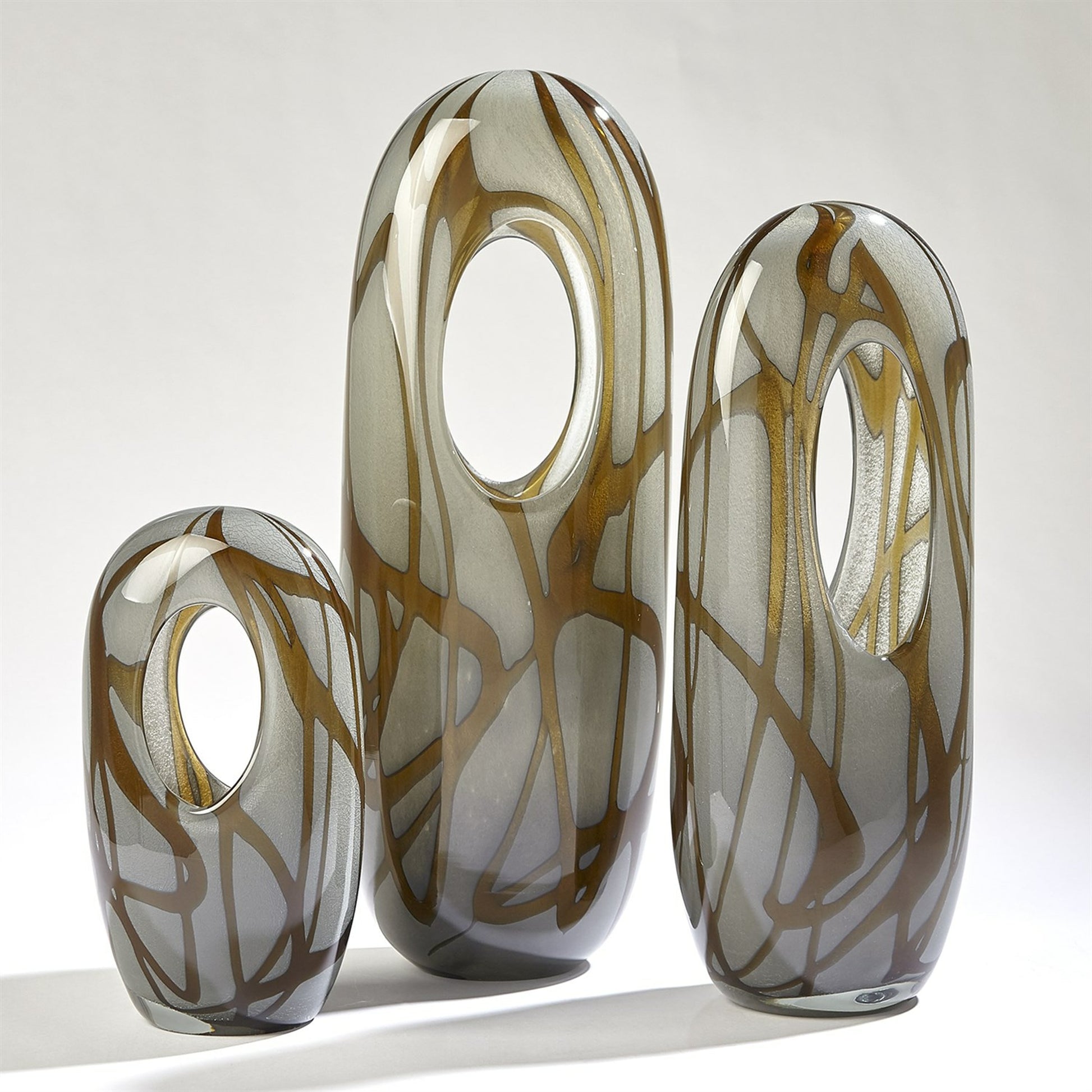 Swirl Vase by Global Views in amber, gray. Made from art glass in a modern style.