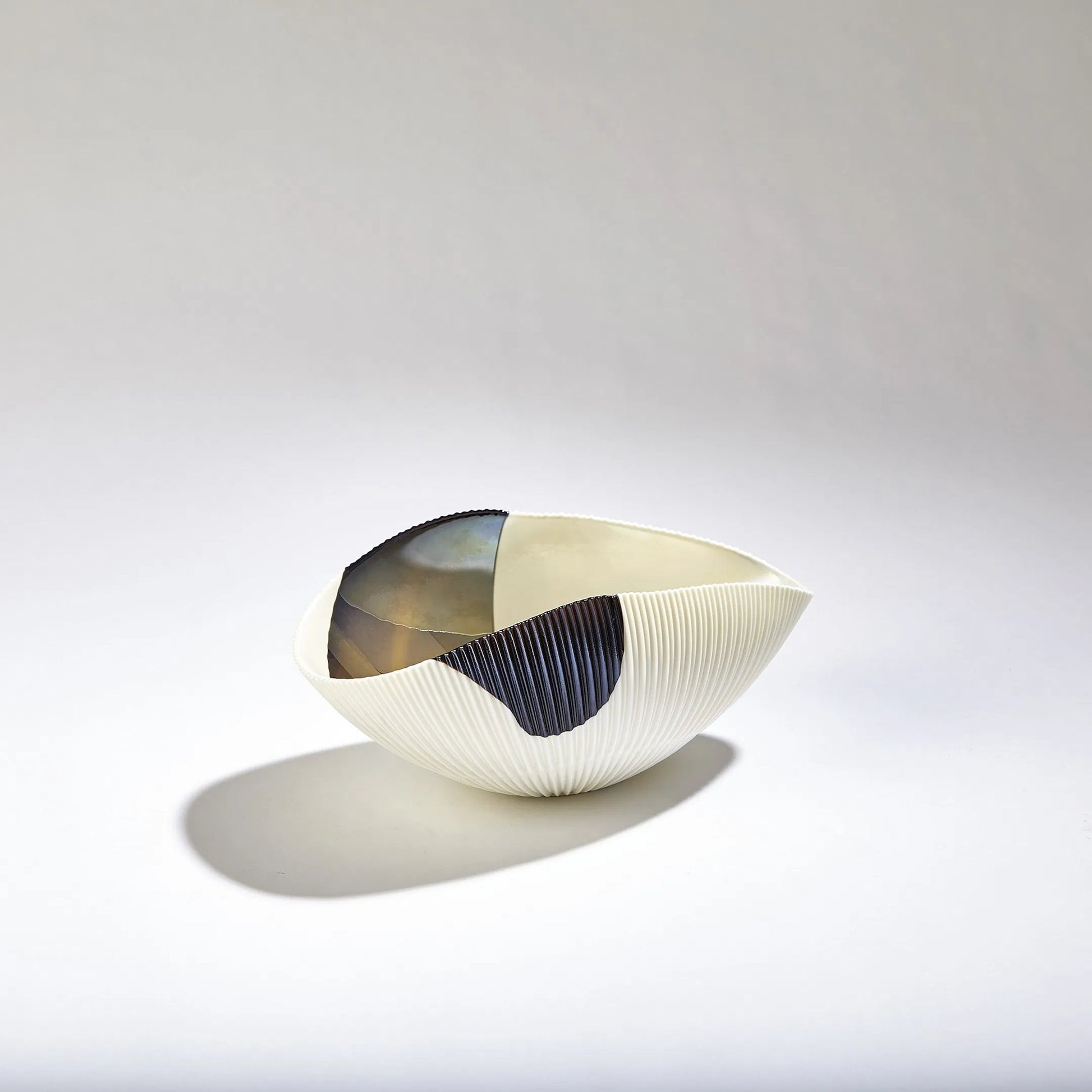 Pleated Bronze Stripe Bowl by Global Views in bronze stripe. Made from artglass in a modern style.