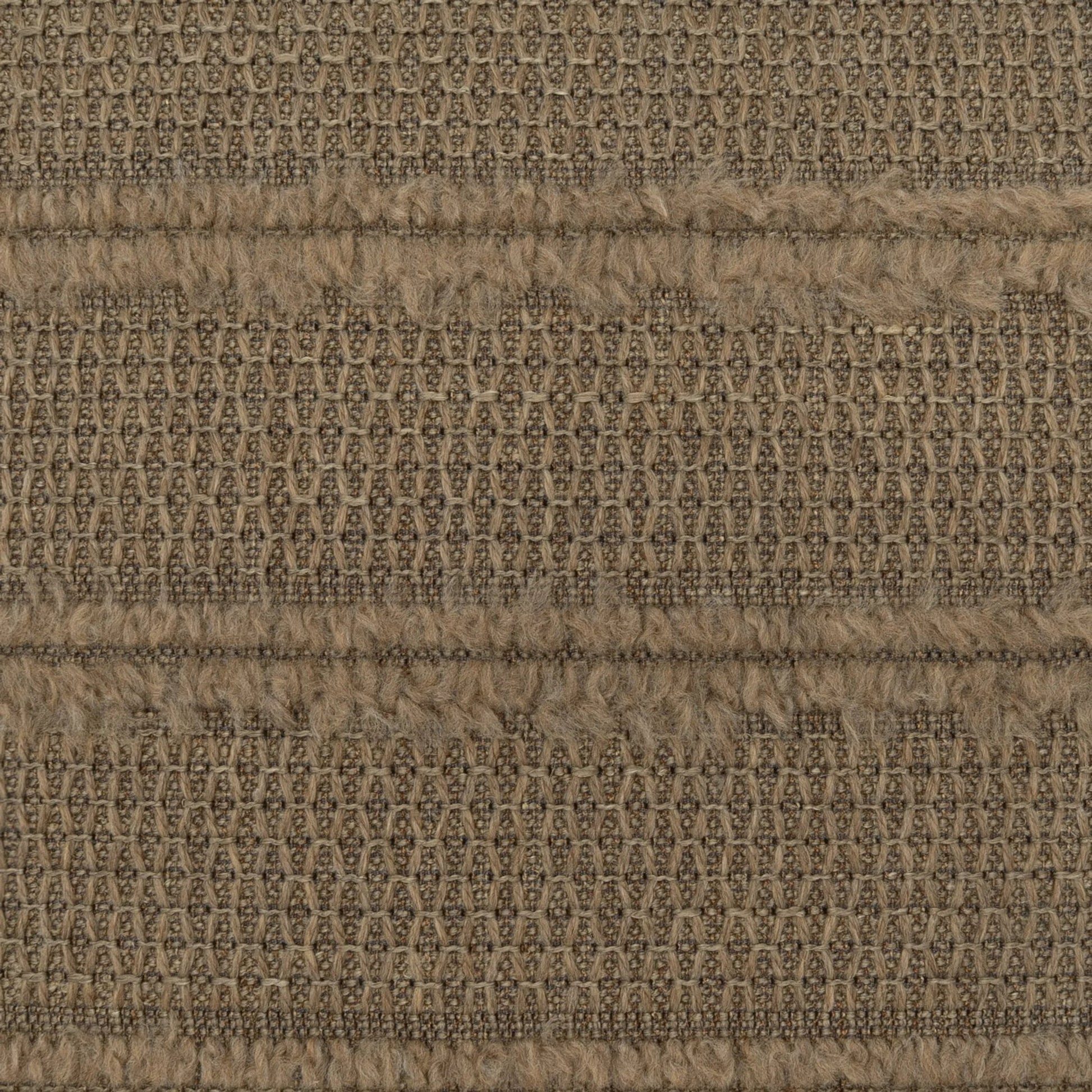 Kitto Pillow by DV Kap Home in mocha. Made from 23% wool, 19% polyester, 18% acrylic, 16% viscose, 16% cotton, 5% polyamide, 3% linen in a unique style.