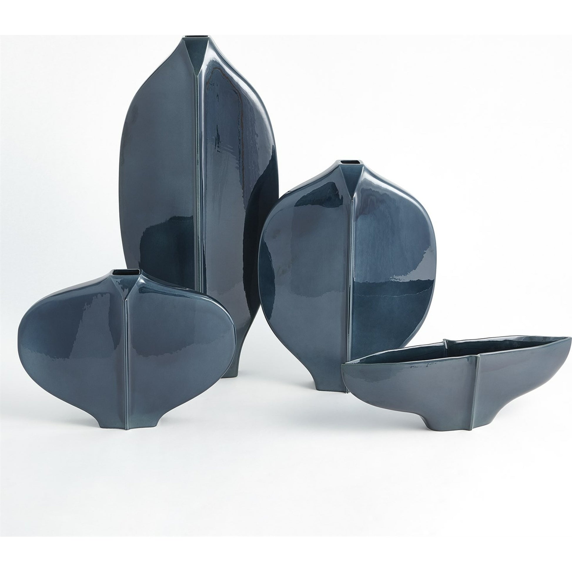 Center Ridge Vase by Global Views in blue. Made from earthenware-reactive glaze in a modern style.