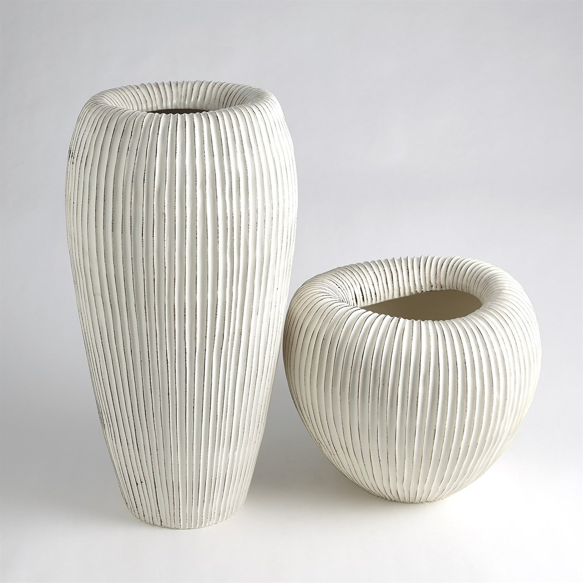 Baleen Cachepot by Global Views in ivory. Made from ceramic in a coastal style.