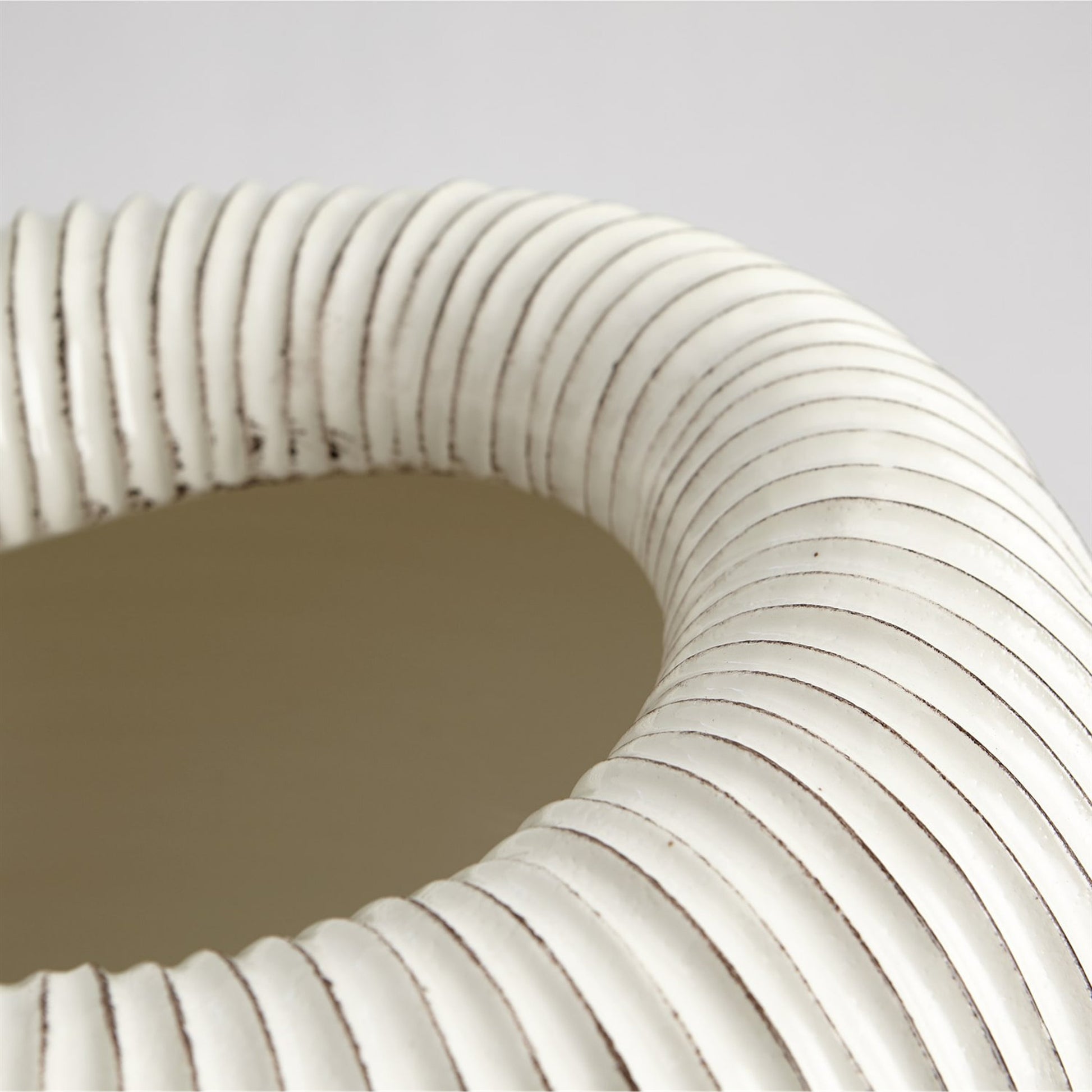 Baleen Cachepot by Global Views in ivory. Made from ceramic in a coastal style.