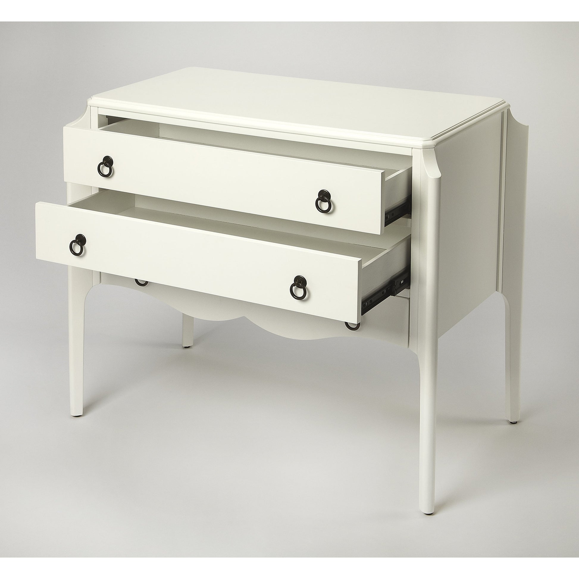Wilshire Accent Chest by Butler Specialty Company in white and glossy white. Made from rubberwood solids, mdf, oak veneer, antique bronze finished hardware in a transitional style.