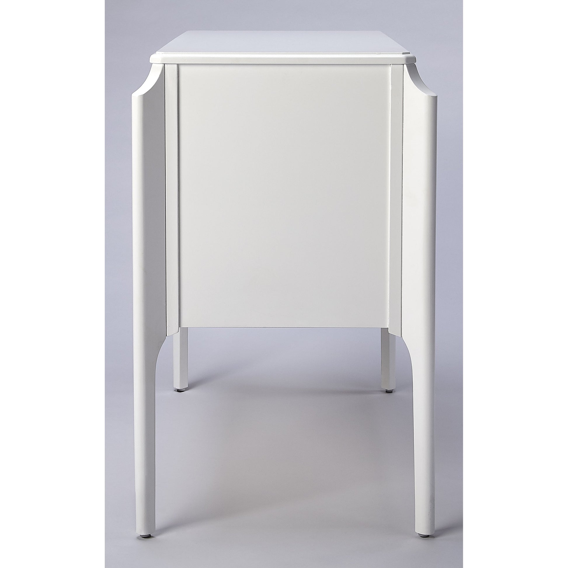 Wilshire Accent Chest by Butler Specialty Company in white and glossy white. Made from rubberwood solids, mdf, oak veneer, antique bronze finished hardware in a transitional style.