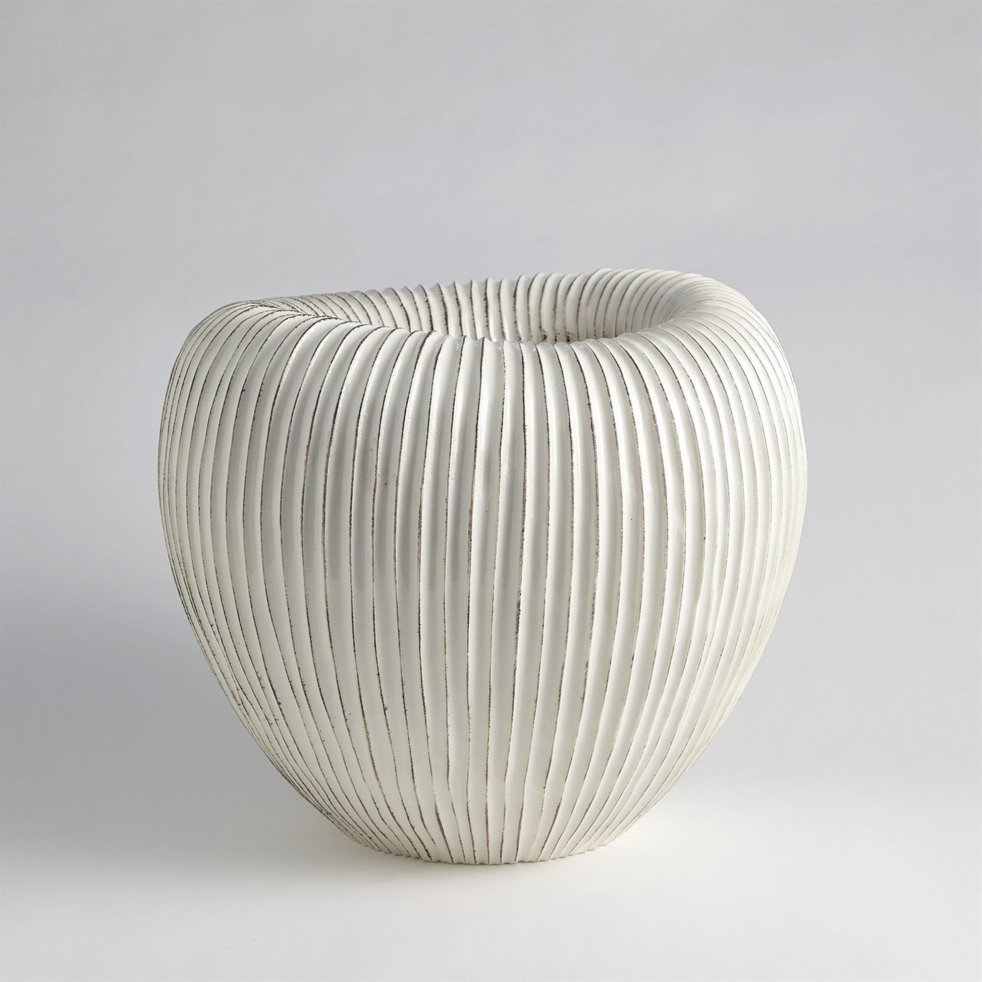 Baleen Cachepot by Global Views in ivory. Made from ceramic in a coastal style.