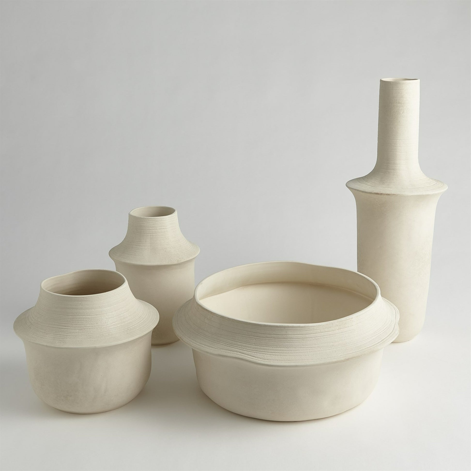 Fladis Bowl by Global Views in matte cream marble. Made from earthenware in a transitional style.