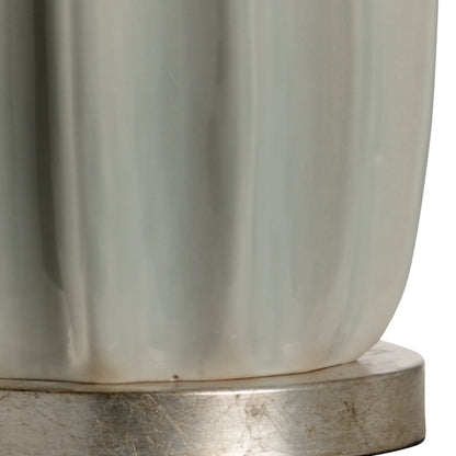 Estelle Lamp by Wildwood in sage green glaze, antique silver leaf. Made from ceramic, porcelain in a modern style.