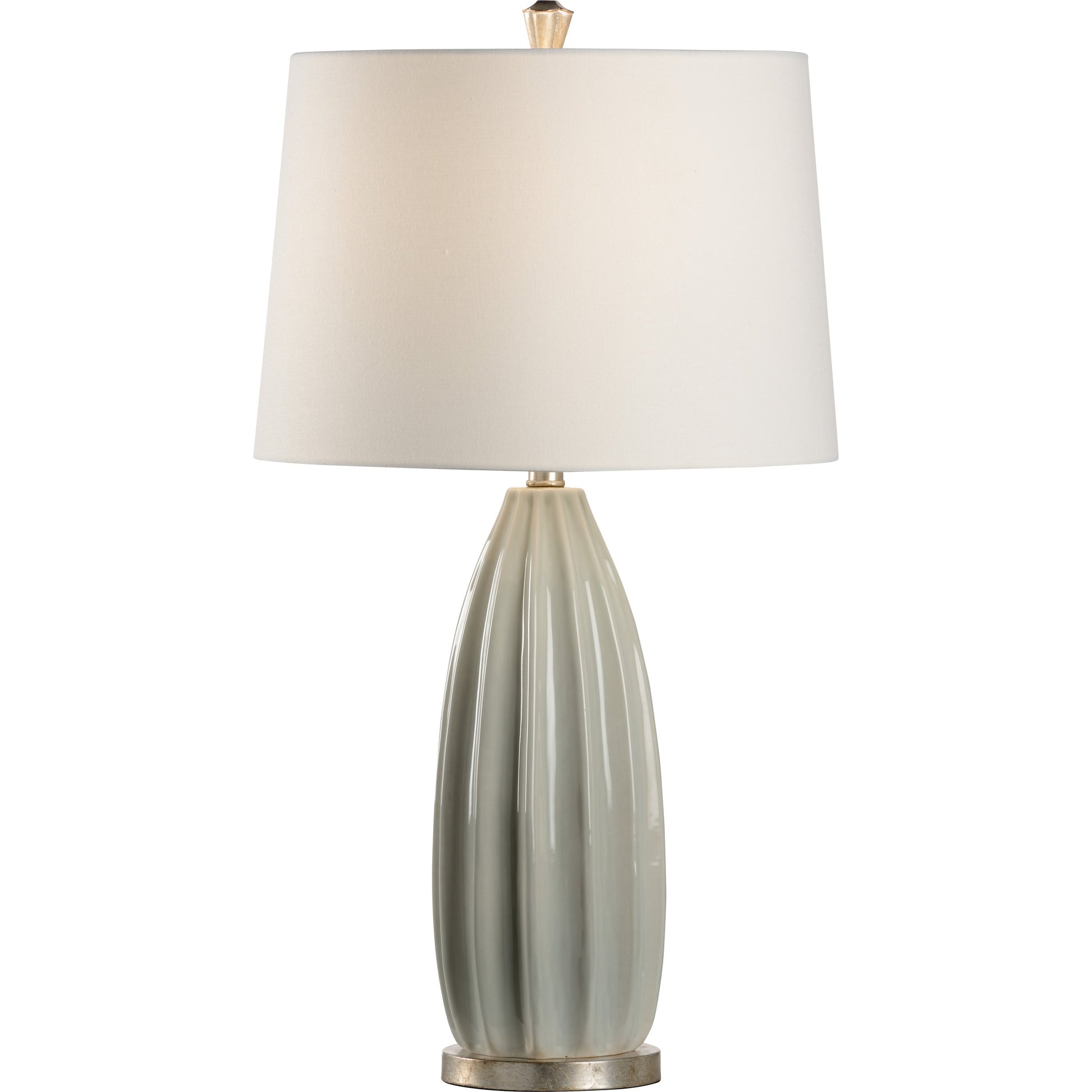 Estelle Lamp by Wildwood in sage green glaze, antique silver leaf. Made from ceramic, porcelain in a modern style.