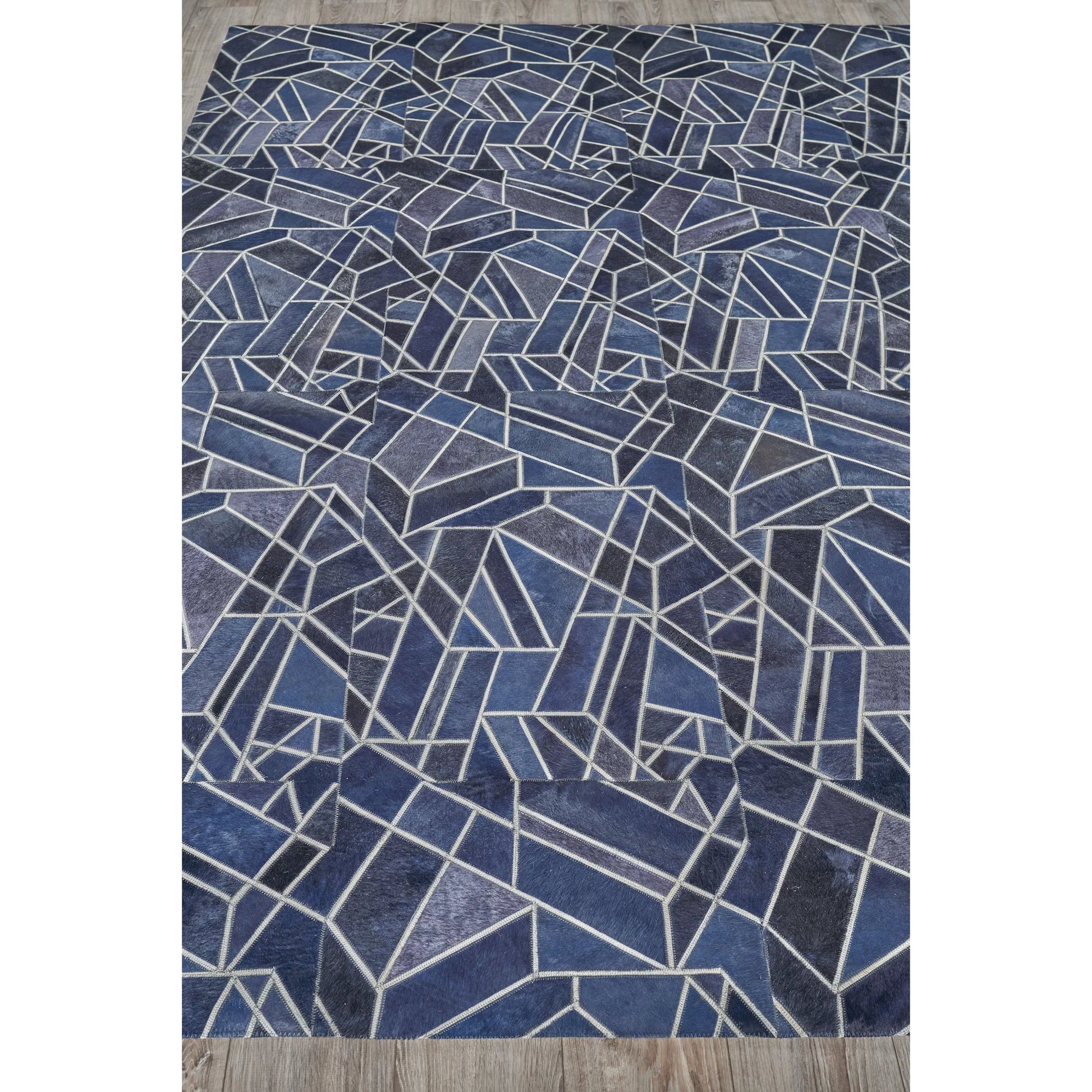 Natural Hide 4780 Rug by Exquisite Rugs in blue, ivory. Made from leather hide in a unique style.