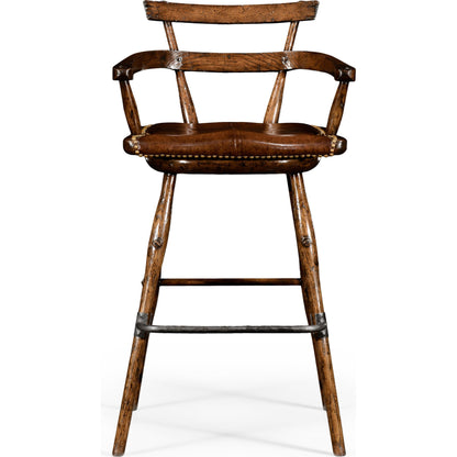 Casual Accents Tudor Oak Studded Leather Bar Stool by Jonathan Charles in brown and dark brown tudor oak. Made from oak in a rustic style.