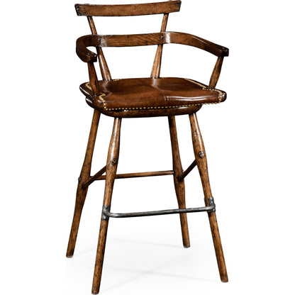 Casual Accents Tudor Oak Studded Leather Bar Stool by Jonathan Charles in brown and dark brown tudor oak. Made from oak in a rustic style.