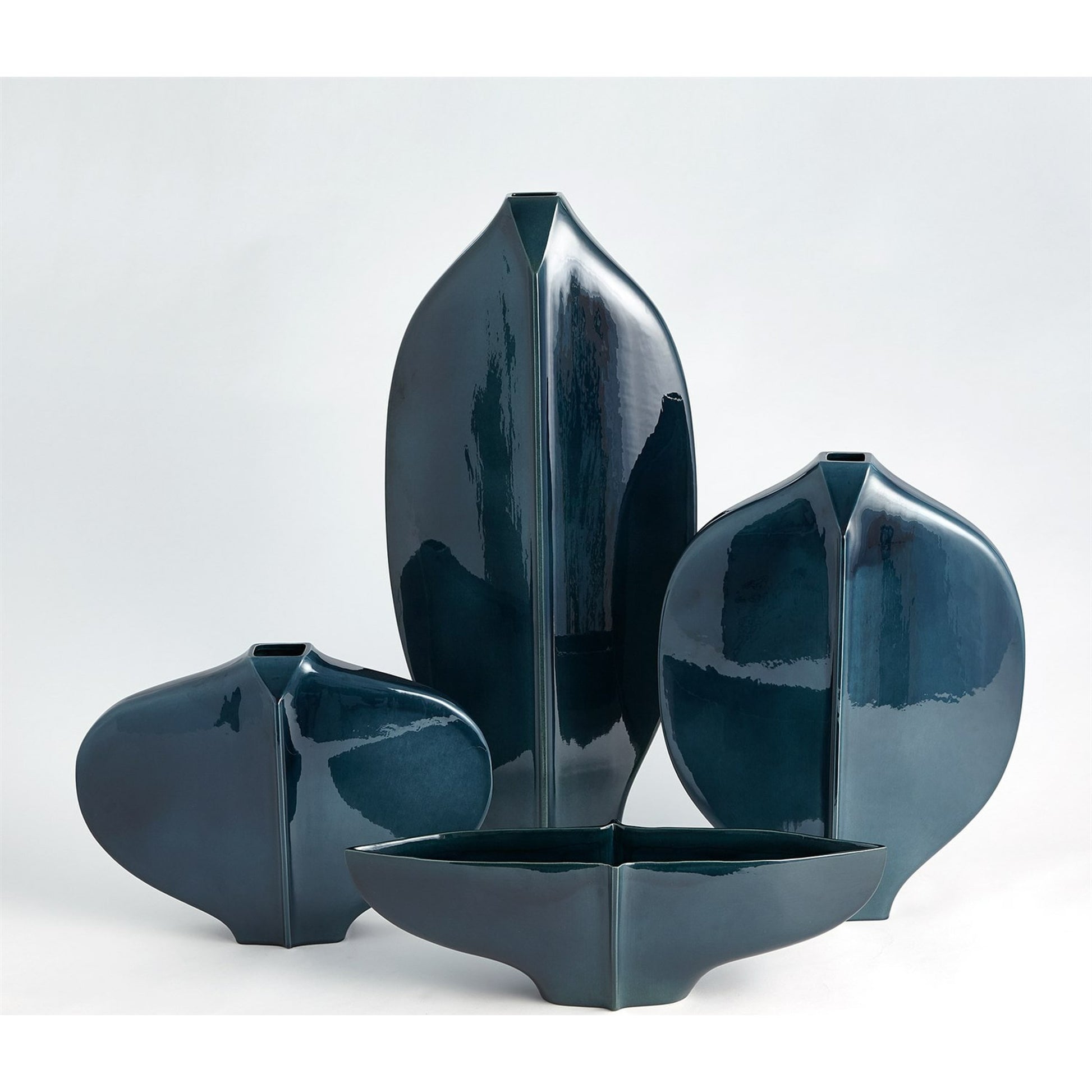 Center Ridge Vase by Global Views in blue. Made from earthenware-reactive glaze in a modern style.