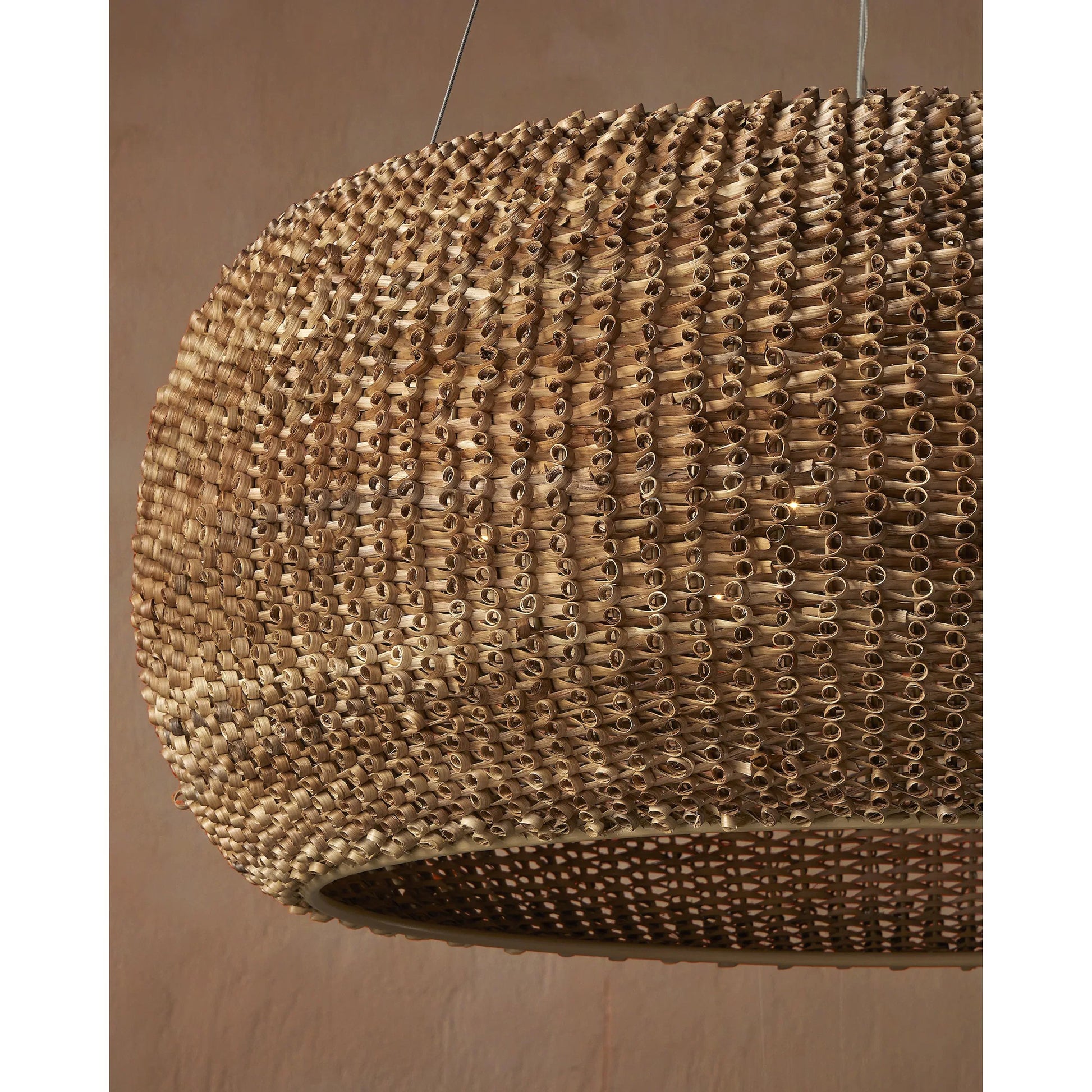 Boucle Chandelier by Currey and Company in natural, beige. Made from rattan, wrought iron in a rustic style.
