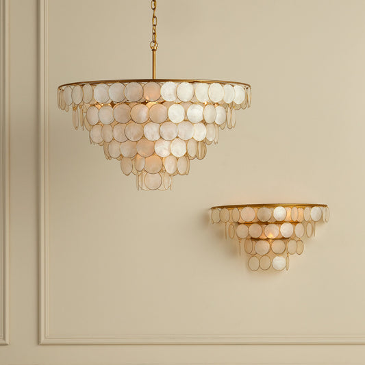 Bon Vivant Wall Sconce by Currey and Company in natural, contemporary gold. Made from capiz shell, wrought iron in a modern style.