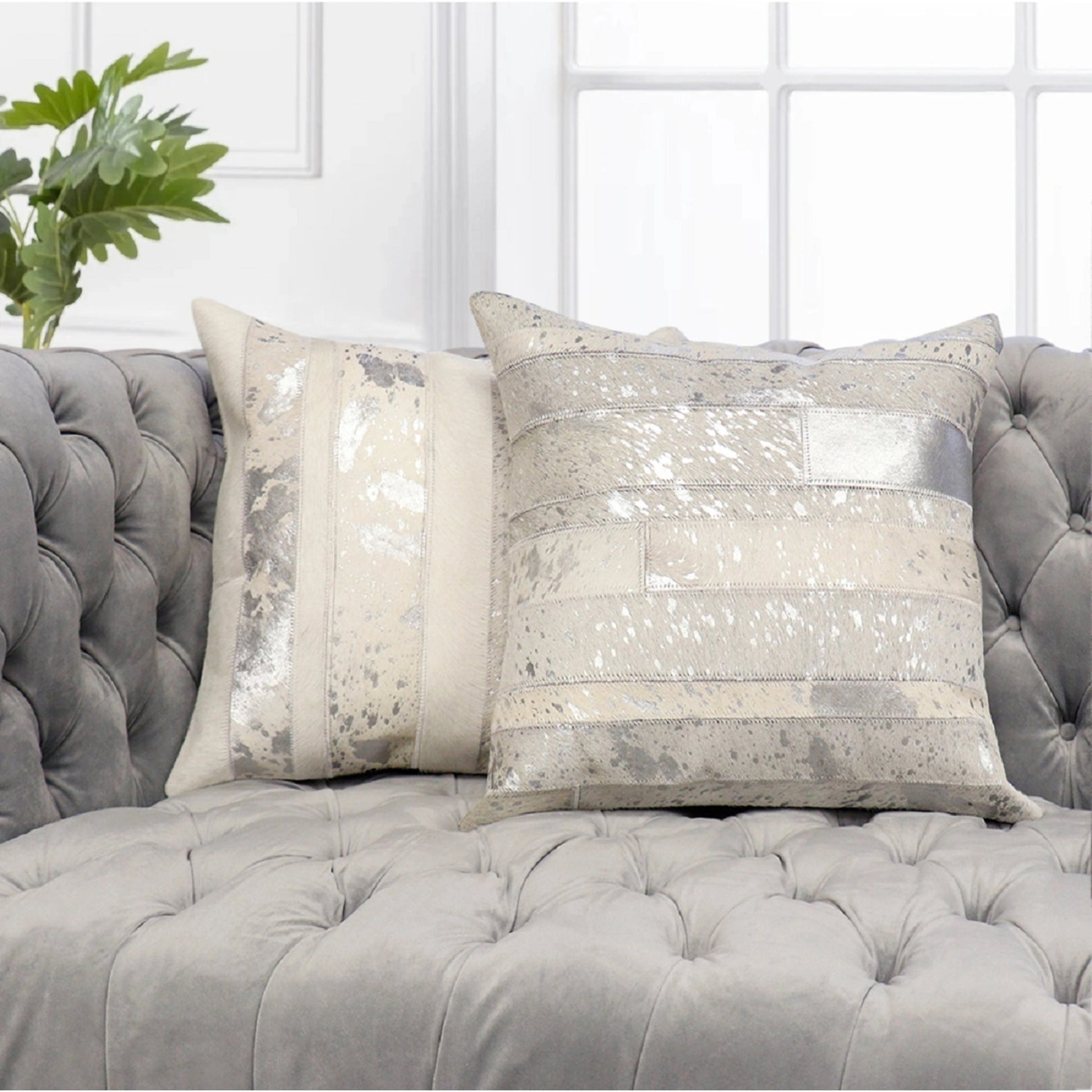 Cowhide Throw Pillow by Pasargad Home in silver. Made from cowhide in a modern style.