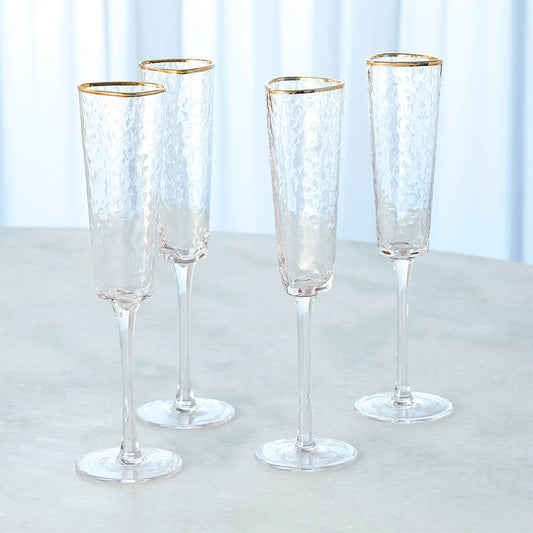 Hammered Champagne Glasses by Global Views in clear w, gold rim. Made from glass in a transitional style.