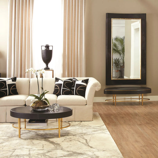 Curved Floor Mirror by Global Views in gold leaf. Made from unique in a transitional style.