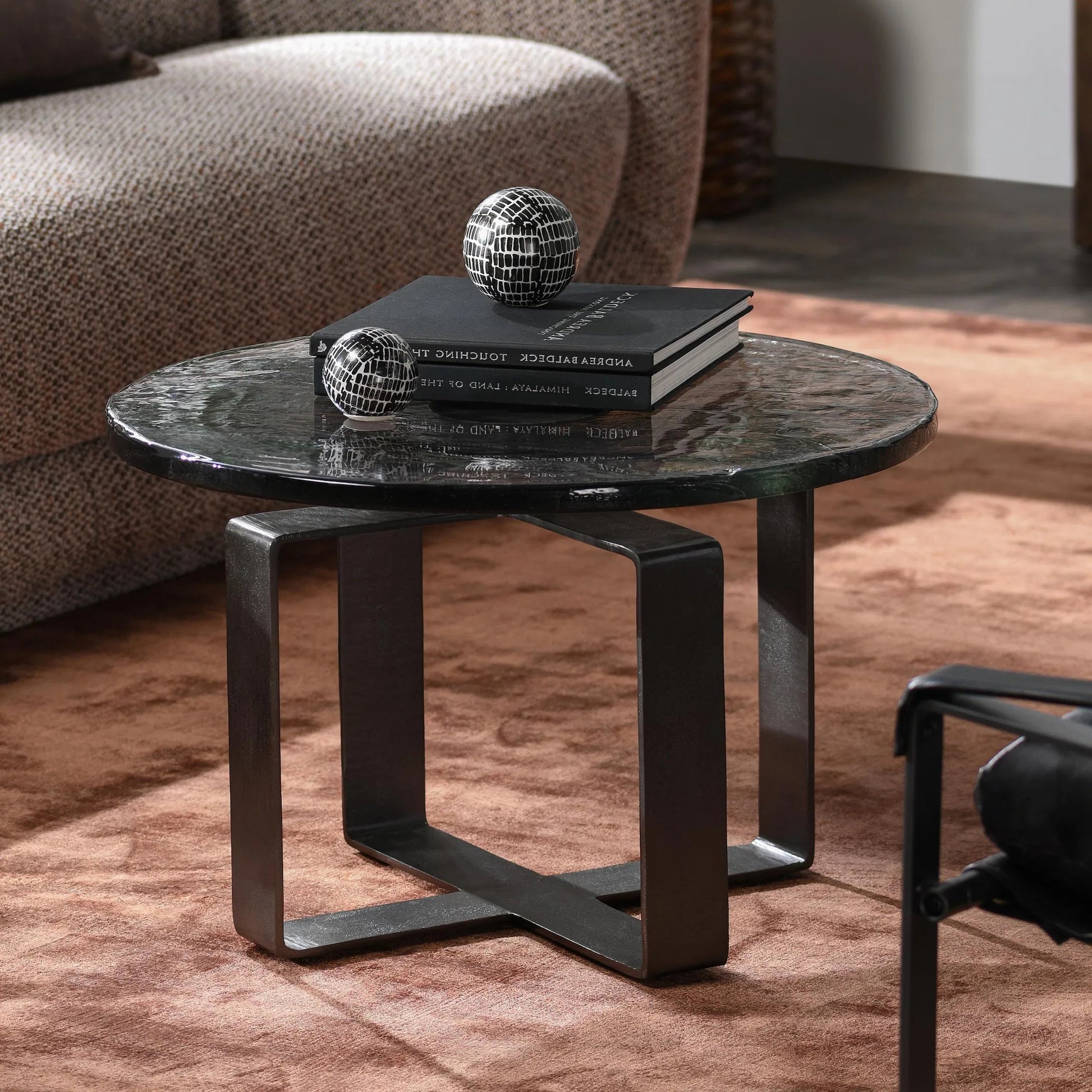 Keith 28" Industrial Glass Black Coffee Table by Classic Home in black. Made from cast glass, iron in a modern style.