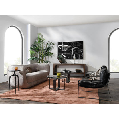 Keith 28" Industrial Glass Black Coffee Table by Classic Home in black. Made from cast glass, iron in a modern style.