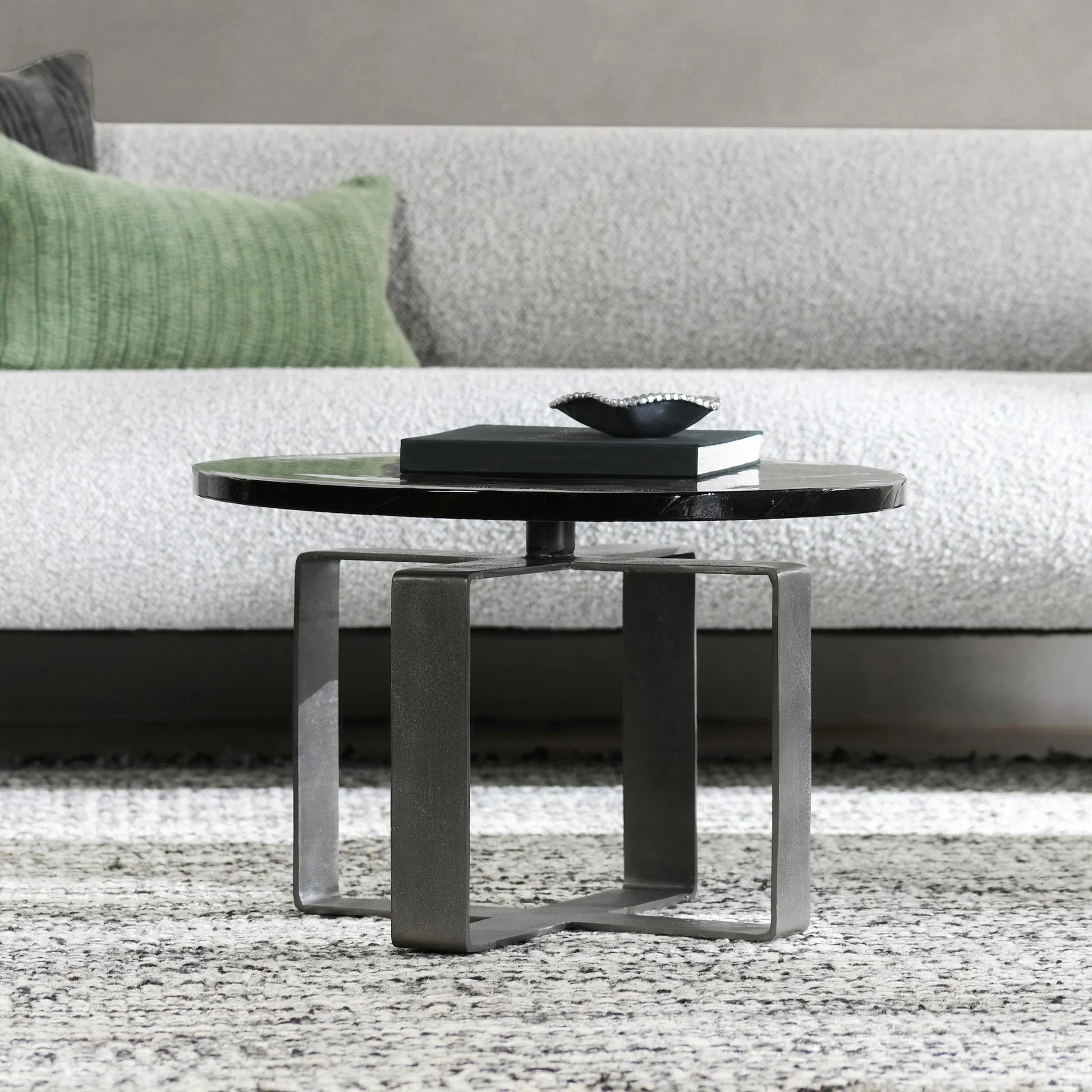 Keith 28" Industrial Glass Black Coffee Table by Classic Home in black. Made from cast glass, iron in a modern style.