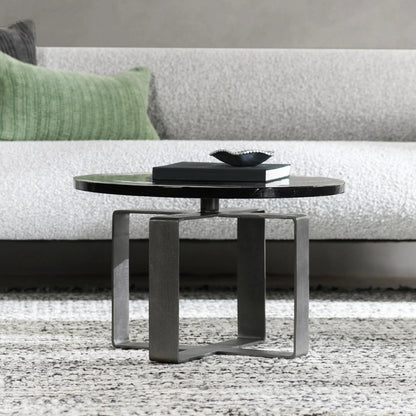 Keith 28" Industrial Glass Black Coffee Table by Classic Home in black. Made from cast glass, iron in a modern style.