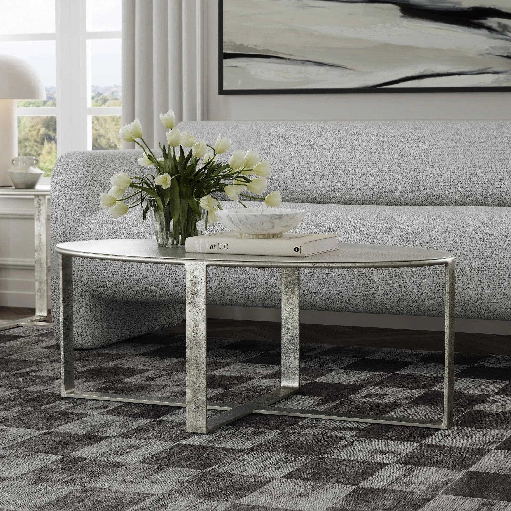 Flores 48" Oval Coffee Table by Classic Home in nickel. Made from cast aluminum in a unique style.