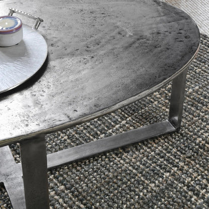 Flores 48" Oval Coffee Table by Classic Home in nickel. Made from cast aluminum in a unique style.