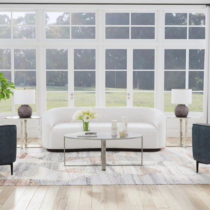Flores 48" Oval Coffee Table by Classic Home in nickel. Made from cast aluminum in a unique style.