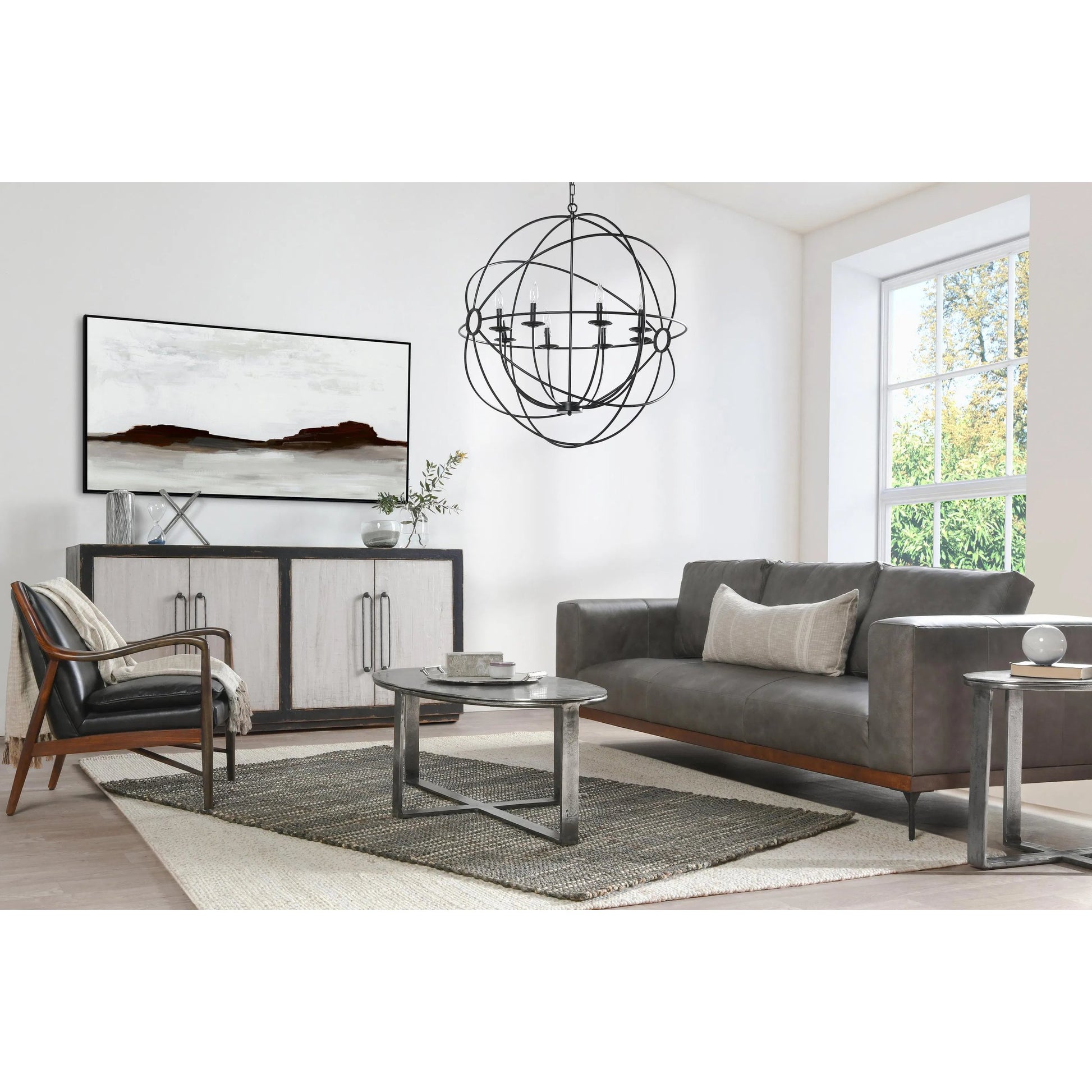 Flores 48" Oval Coffee Table by Classic Home in nickel. Made from cast aluminum in a unique style.