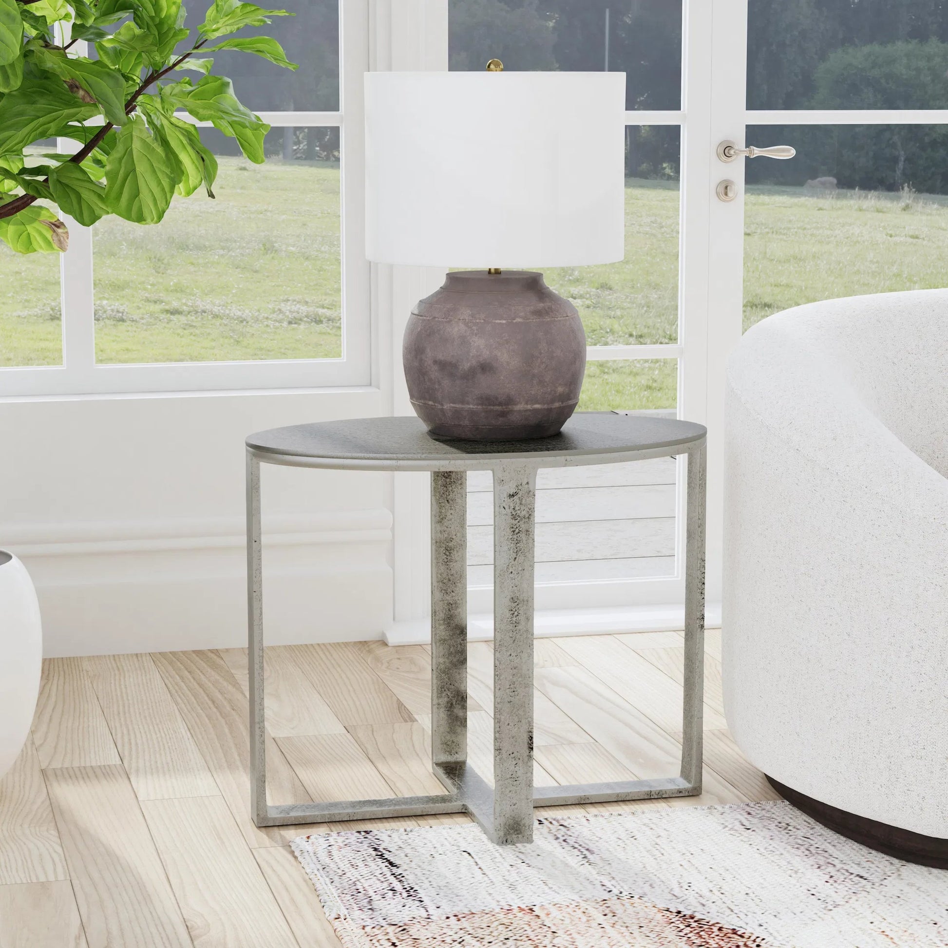 Flores 27" Oval End Table by Classic Home in nickel. Made from cast aluminum in a unique style.
