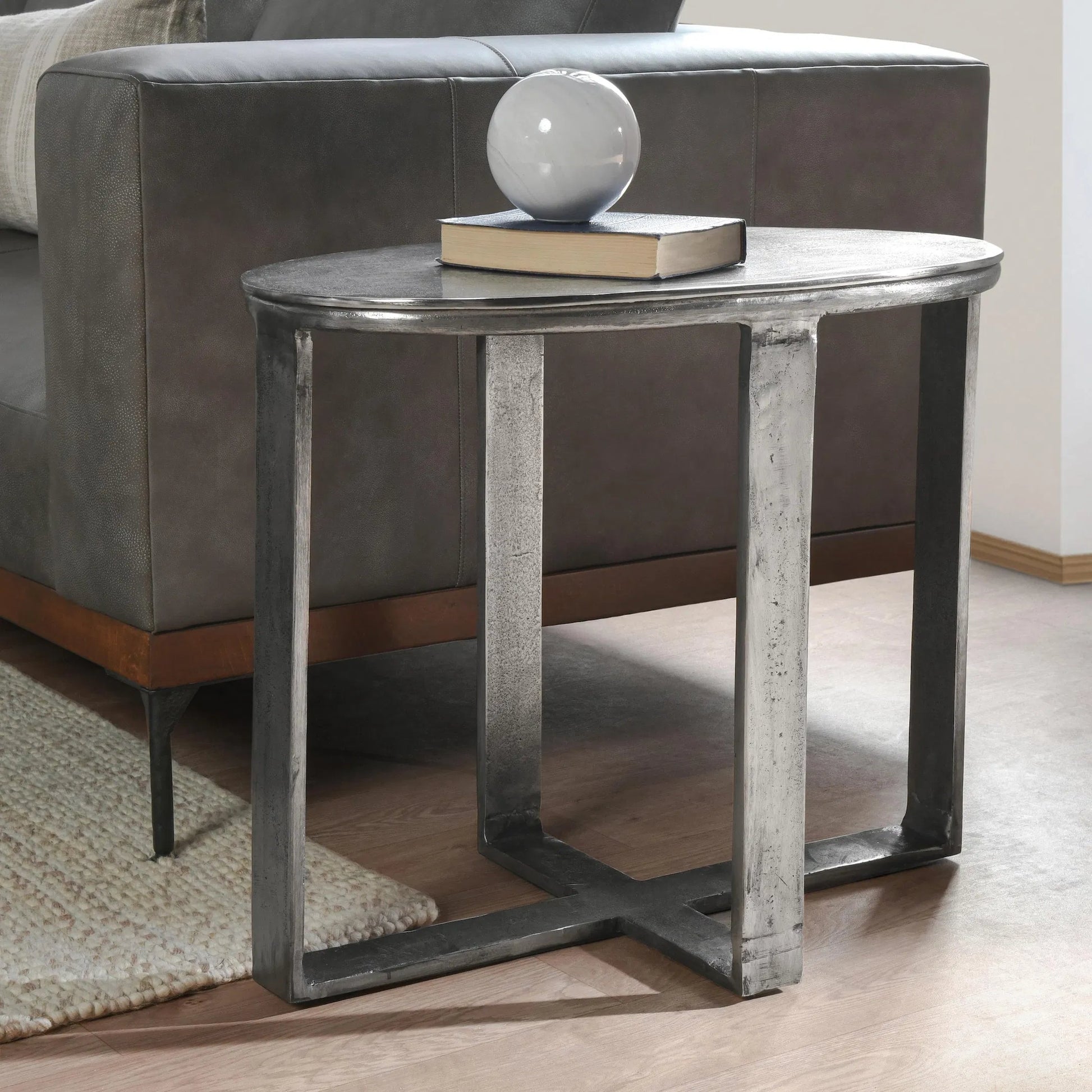 Flores 27" Oval End Table by Classic Home in nickel. Made from cast aluminum in a unique style.