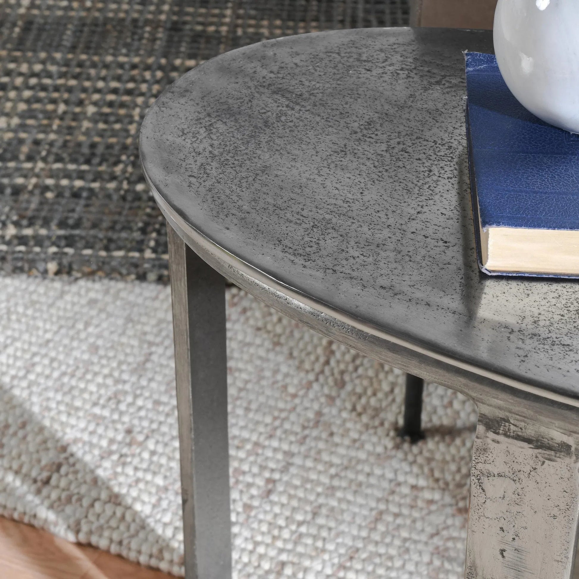 Flores 27" Oval End Table by Classic Home in nickel. Made from cast aluminum in a unique style.