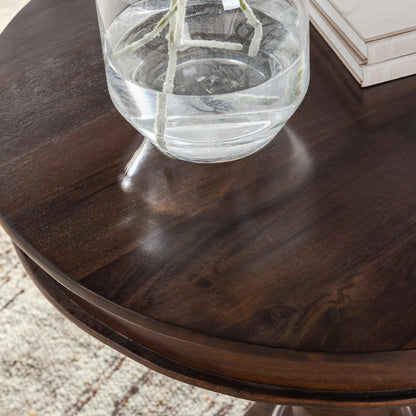 Bella Mango Wood 30" Round Table by Kosas Home in dark brown. Made from mango wood in a unique style.