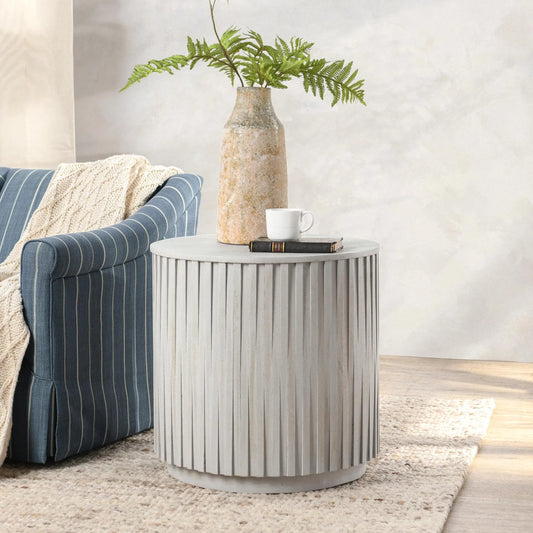 Mrytle Round End Table by Classic Home in distressed light gray. Made from mango wood in a modern style.