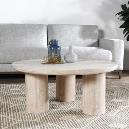 Beau Solid Wood Round Coffee Table by Kosas Home. Made from mango wood in a modern style.