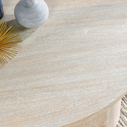 Beau Solid Wood Round Coffee Table by Kosas Home. Made from mango wood in a modern style.