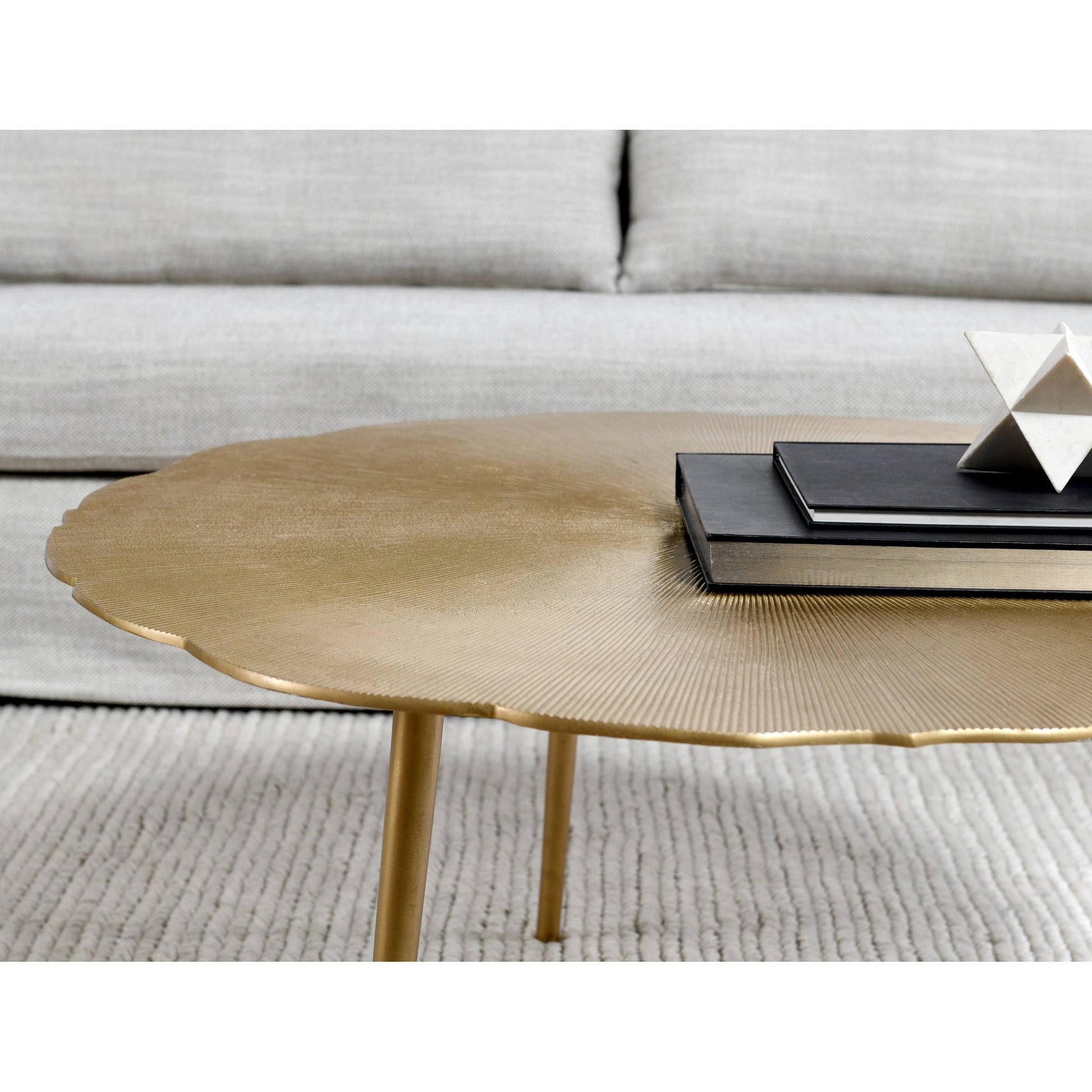 Violetta Coffee Table by Kosas Home in gold. Made from aluminum in a modern style.