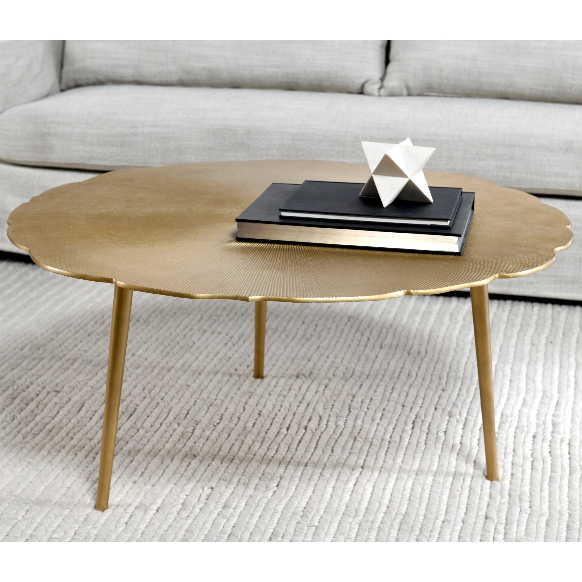 Violetta Coffee Table by Kosas Home in gold. Made from aluminum in a modern style.