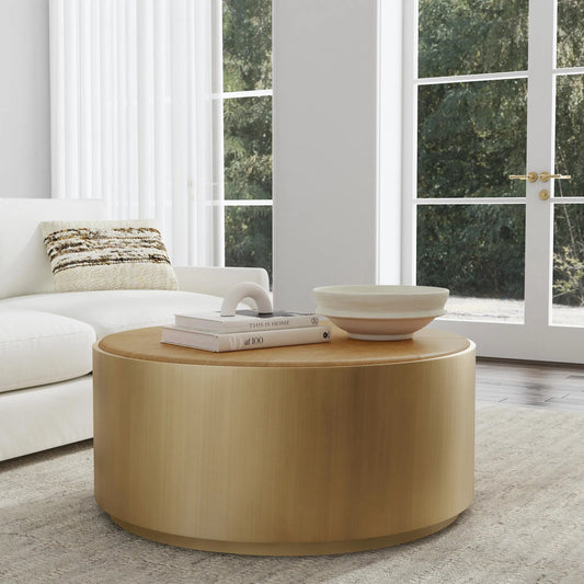 Evan Round Brass Coffee Table by Kosas Home in brass base, natural brown top. Made from iron, top grain leather in a unique style.