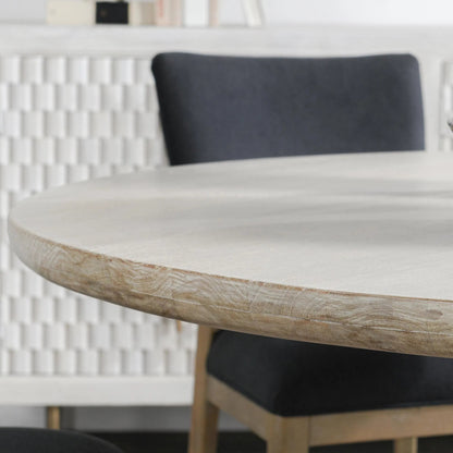 Hera Mango Washed Wood Round Dining Table by Classic Home. Made from mango wood in a unique style.