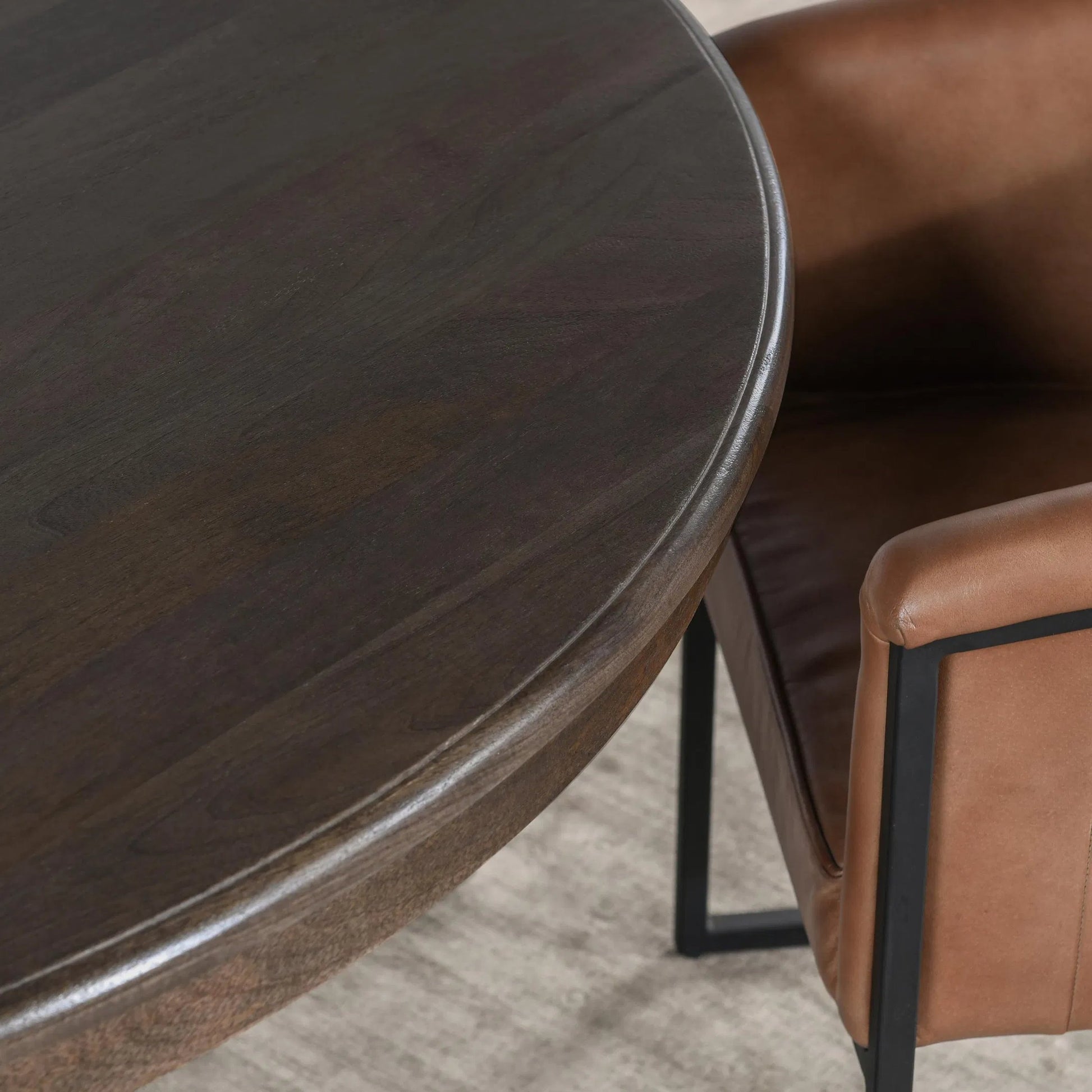 Brookside Round Mango Wood Dinning Table by Classic Home in cocoa brown. Made from mango wood in a traditional style.
