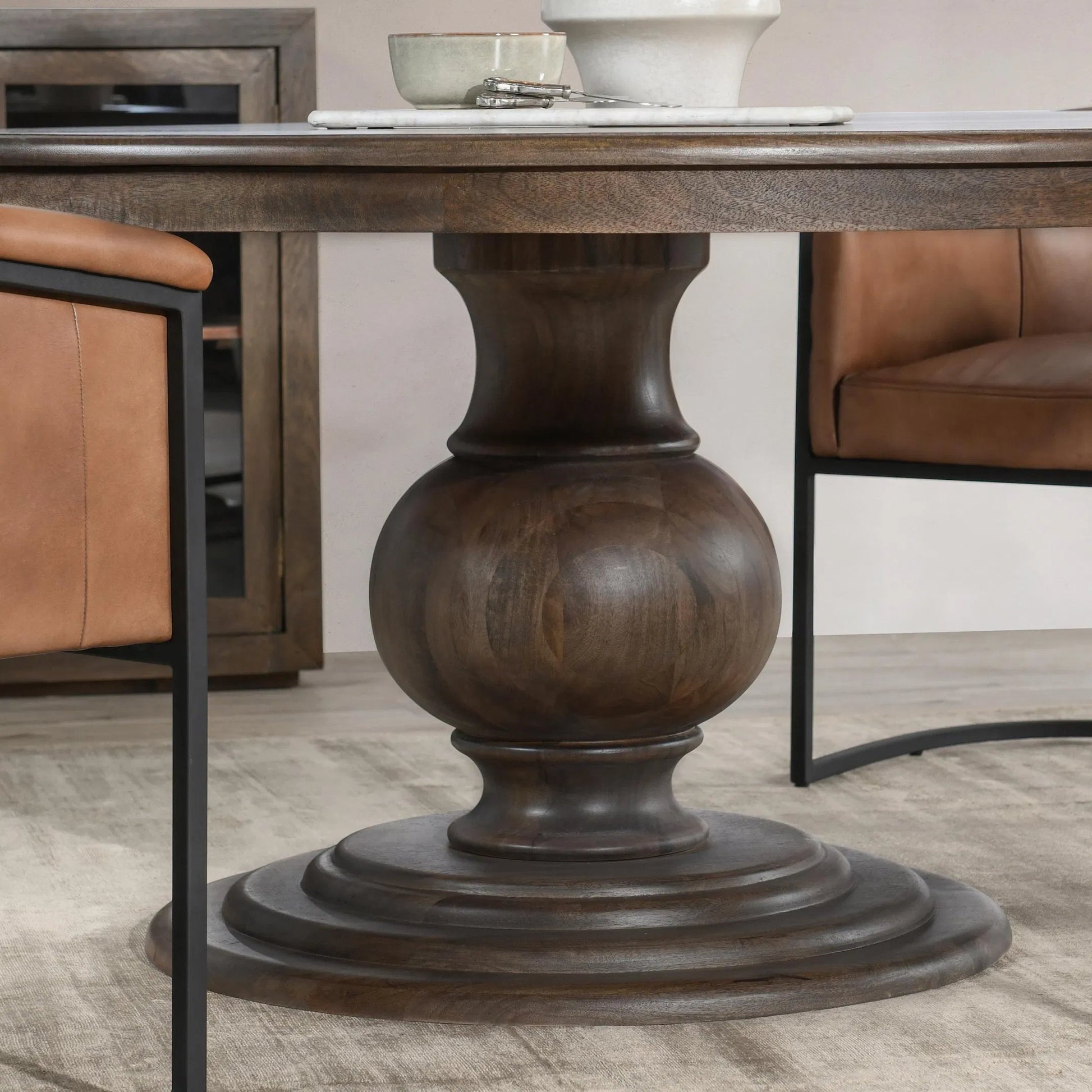 Brookside Round Mango Wood Dinning Table by Classic Home in cocoa brown. Made from mango wood in a traditional style.