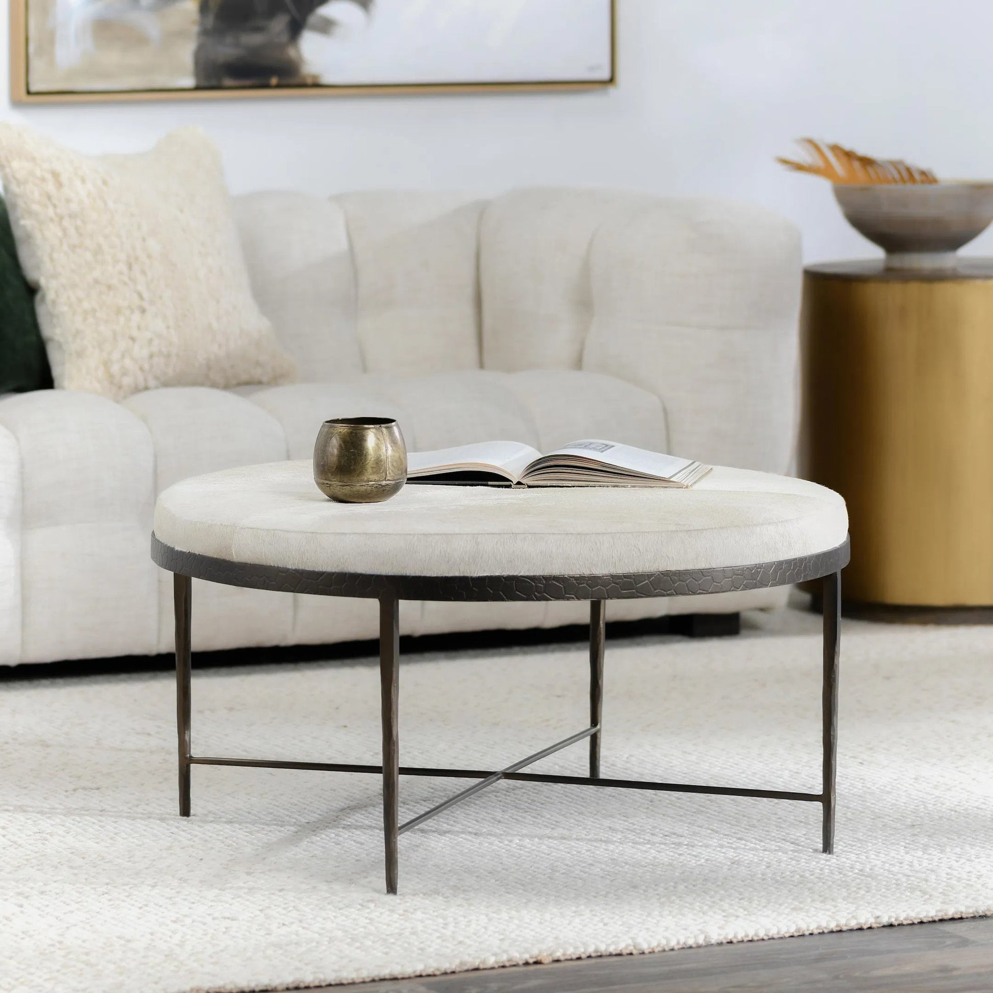 Bose Leather Round Cocktail Coffee Table by Classic Home in ivory. Made from hair on hide, embossed hammered iron in a unique style.
