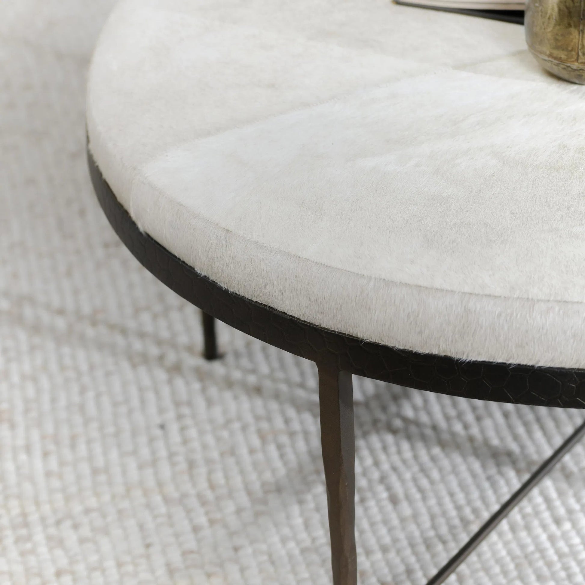 Bose Leather Round Cocktail Coffee Table by Classic Home in ivory. Made from hair on hide, embossed hammered iron in a unique style.