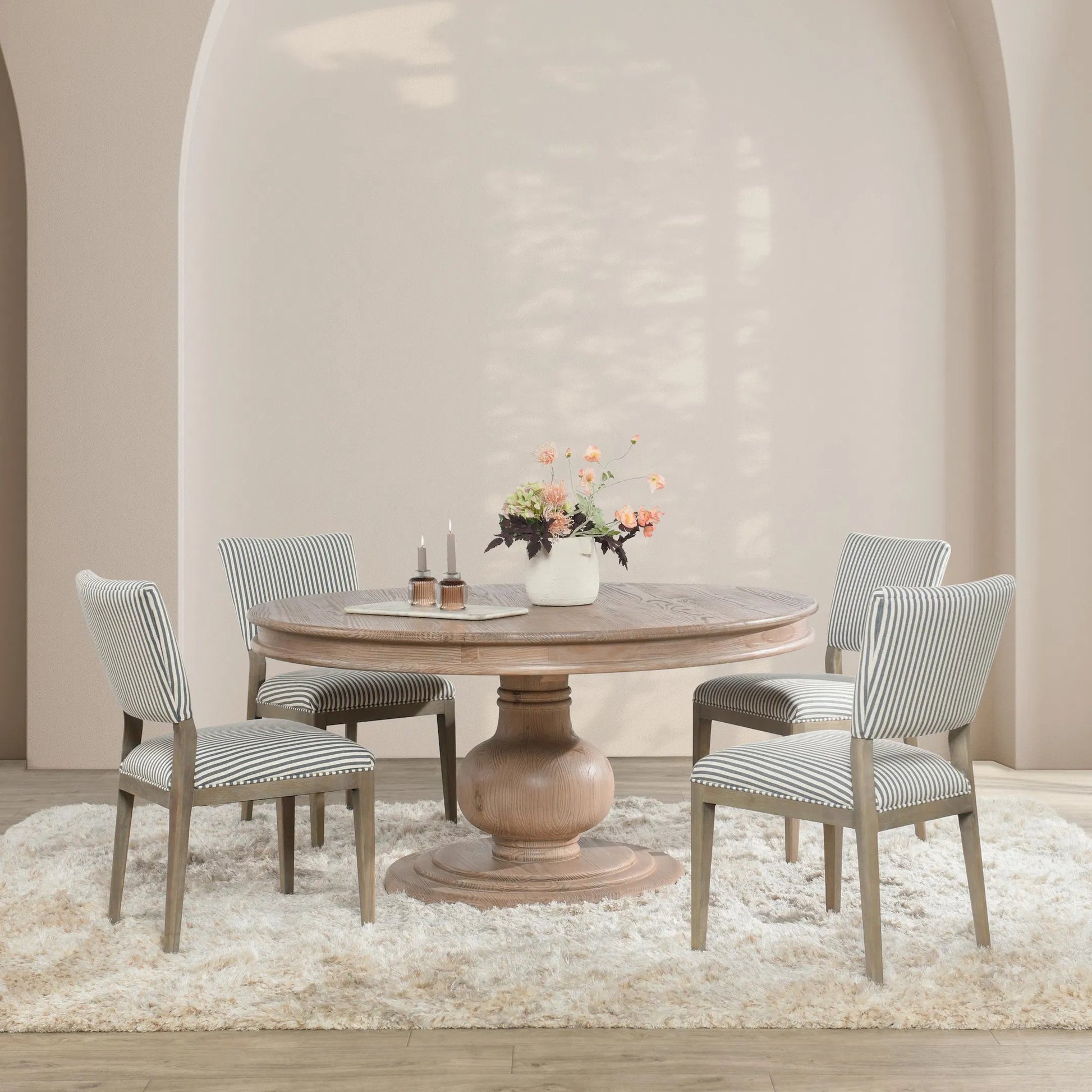 Baldwin 60" Pine Wood Round Dining Table by Kosas Home in taupe. Made from pine wood in a transitional style.