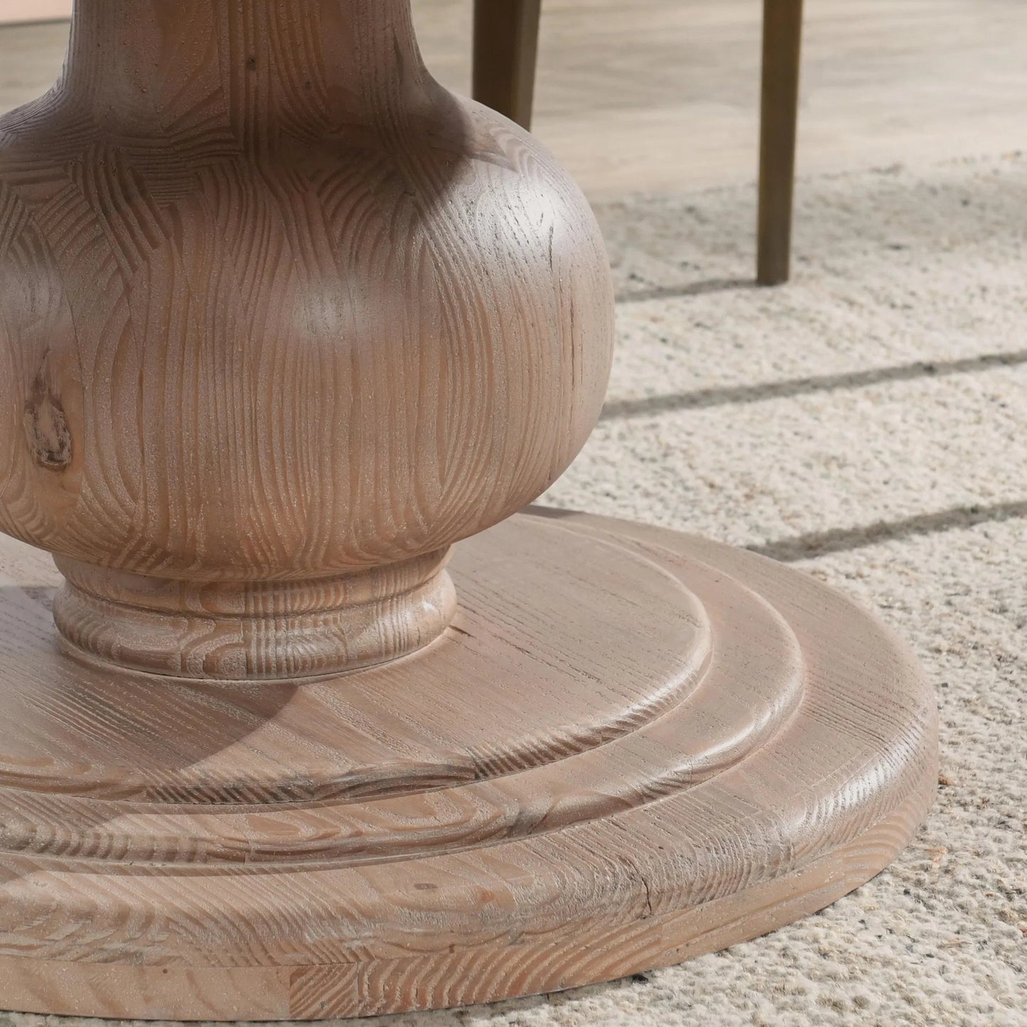 003 SI-2238820 | Closeup | Baldwin 60" Pine Wood Round Dining Table by Kosas Home in taupe. Made from pine wood in a transitional style.